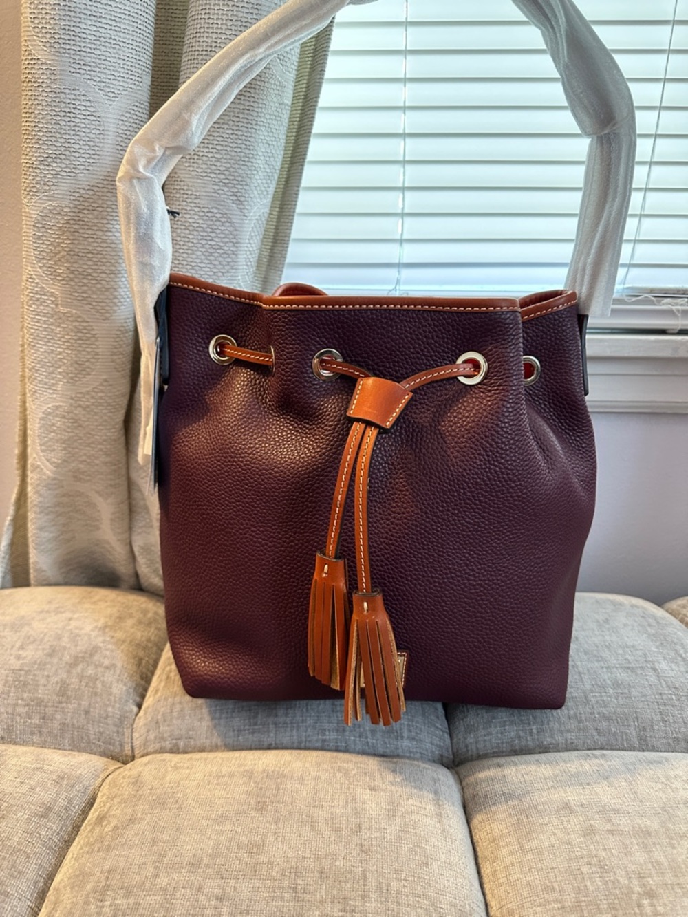 Dooney & Bourke Pebble Grain Aimee Drawstring with Matching Wallet in Bordeaux.